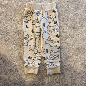 rebels Cream Sweatpants with Black Dinosaur Sketches